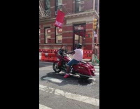 Motorcyclist sings to if you wanna be my lover 