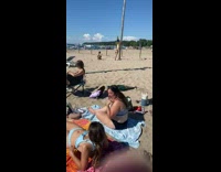 Black bikini girl sand hands on tree