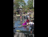 Girl blocks walkway in water fountain 