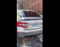 Parked car on crates with missing wheels