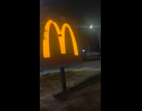 Guy throws block of butter at mcdonalds sign 