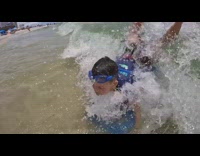 Boy falls off boogie board does scorpion 