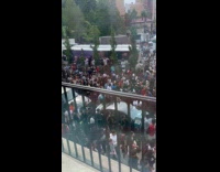 Rioters crowding the whole street 