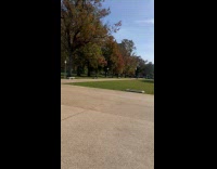 Two people tiktok dance by the fountain