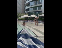Woman in bikini poses at the swimming pool stairs Part 2