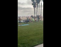 Woman black bikini dance with light illusion on the beach park