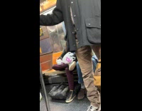 Woman ride train eat food in plastic