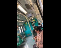 Woman black sweater dances inside the train