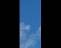 Two airplane flies close together in the sky
