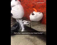 Person wears Olaf mascot costume and head falls off, subway station