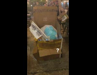 Person Walks and Squats in Plastic and Cardboard Boxes 