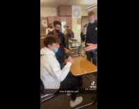 Guy grabs dollar before teacher can prank