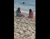 Ladies at Beach Take Picture with Wine Glass