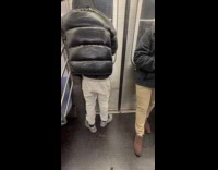 Man sings and raps at subway door