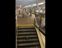 Shirtless guy walks upstairs in skirt and antlers 