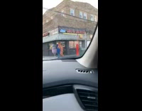 Two people inflatable costumes wait by deli