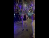 Man in suit on swing hits woman