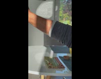 Man hand reflects on sunlight at the wall