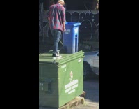 Guy checkered sleeves look blue trash bin