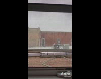 Woman tries to close broken window latch