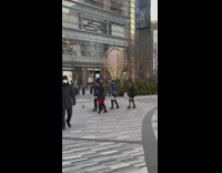 Group of kpop dancers dancing for video and wedding party walks by