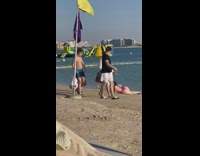 Woman bikini lay on beach inflatable island