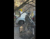 Workers Dig Street Water Leak Near Car