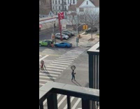 Guy balances tire on head 