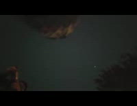 Woman puts camera under to film fireworks