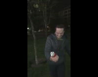 guy in gray shirt trying open beer can with his head