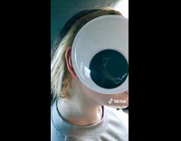 Woman does side eye with big googly eyes 