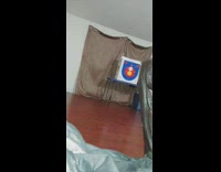 Guy shoots arrow into glass window curtain 