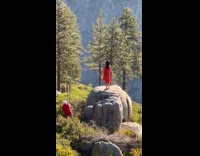 Collab IITW - Woman red dress stand over rock mountain