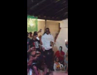 Woman twerks on guy on chair 