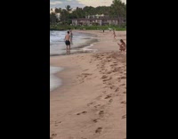 Man black shorts did a double side flip at the beach