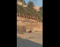 Guy has photoshoot alone on beach