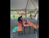 Guy orange table beer can drink tent