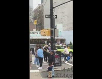 Biker balances trash can on head