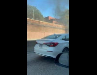 Submitter passed by fire burning on road
