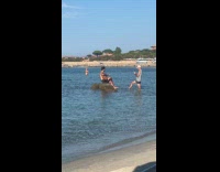 Collab IITW - Man on top of Rock at Beach Plays Guitar