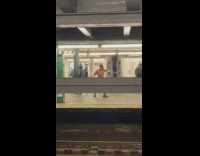 Man practices fighting moves with knife in subway station