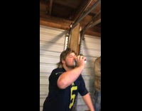 Guy smashes beer can against head garage 