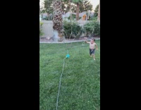 Little kid uses powers to turn on water toy