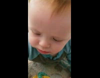 Baby tries solid food for first time