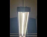 Water gushing out from subway ceiling to lights