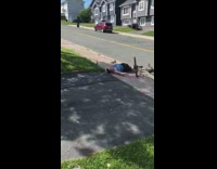 Guy rides bike down hill falls down