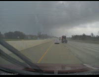Car drives through storm shows cool clouds