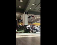 Guy does pushup with heavy tire on back 