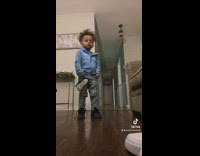 Toddler sings to song with toy gun 