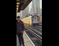People ride on top of train NYC